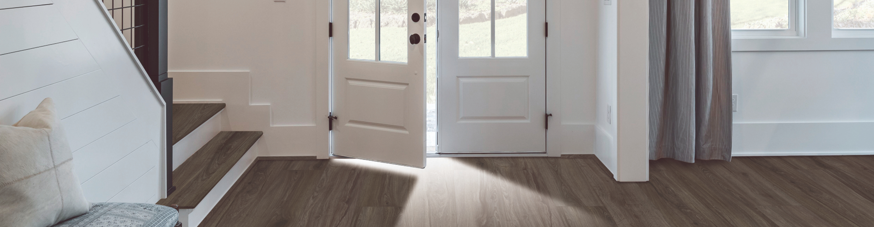 Luxury vinyl tile flooring with a marble-look design installed in a modern room.